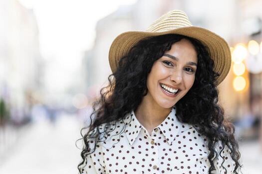 files/beautiful-young-latin-american-woman-portrait-woman-walking-in-evening-city-in-hat-with-curly-hair-in-warm-weather-smiling-and-looking-at-camera-close-up-photo_c799fe2b-a2e4-499f-9158-ef5850ba868c.jpg